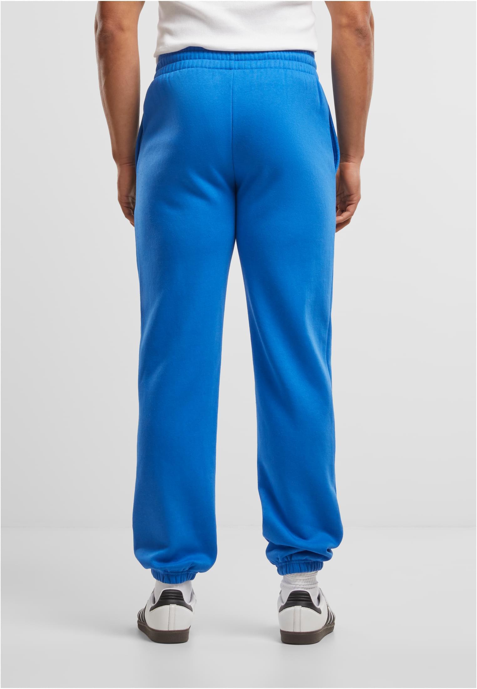 Build Your Brand Basic Joggers – Intense Blue – on model 3