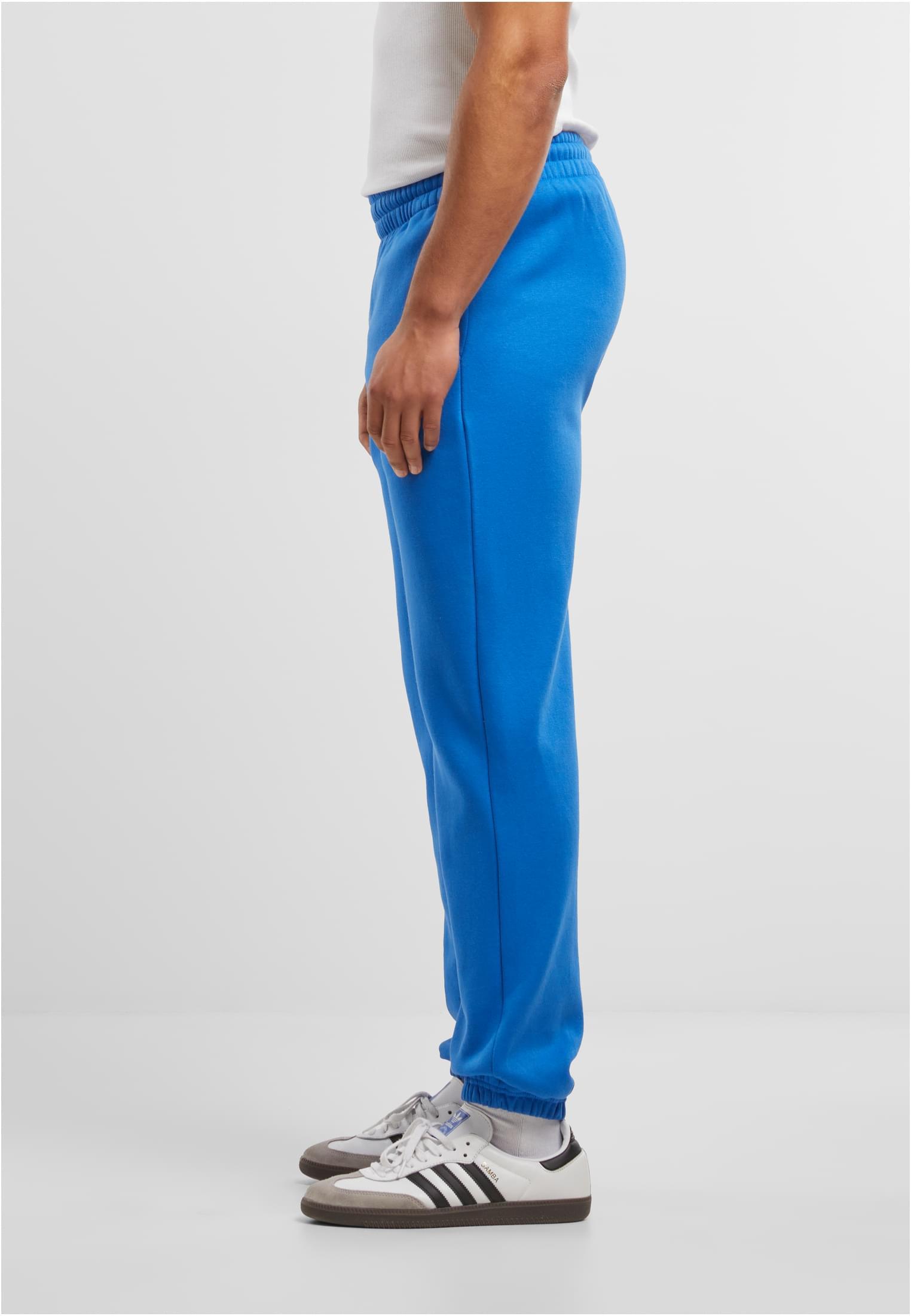 Build Your Brand Basic Joggers – Intense Blue – on model 2